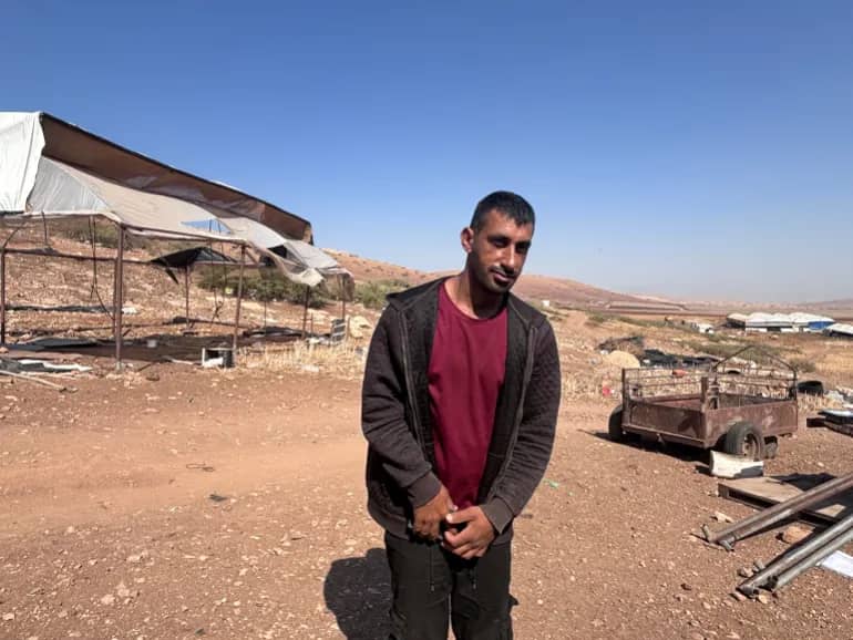 Thaer-Bisharat-beside-his-home-1784311543.jpg