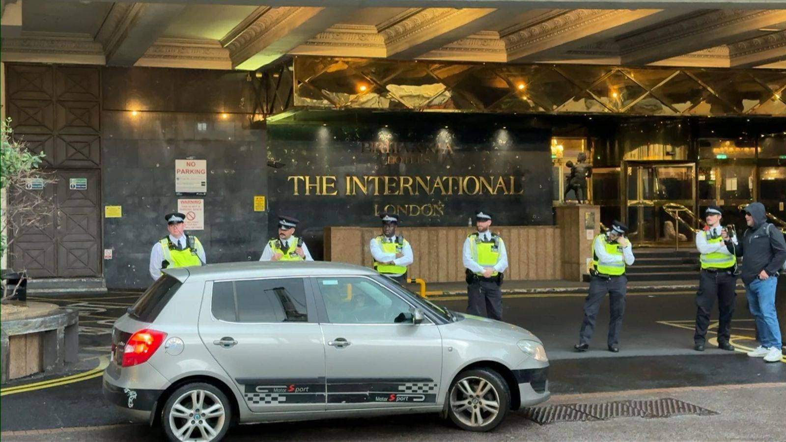 Police attend protest outside London hotel which will house asylum seekers
