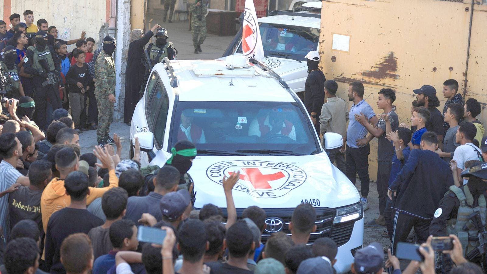 Israel says first hostages handed over as Palestinian prisoners also expected to be released