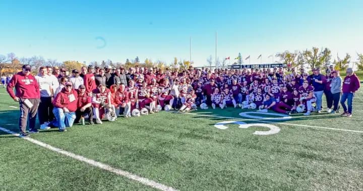 Regina Thunder receives Prairie Football Conference trophy from Saskatoon Hilltops