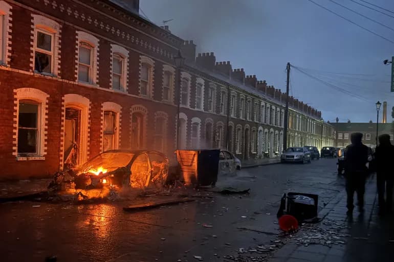 Protesters set fire to vehicles and buildings in Belfast following stabbing incident