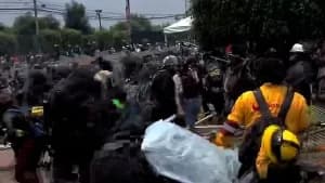 Riot police engage with stone-throwing protesters at World Cup opening